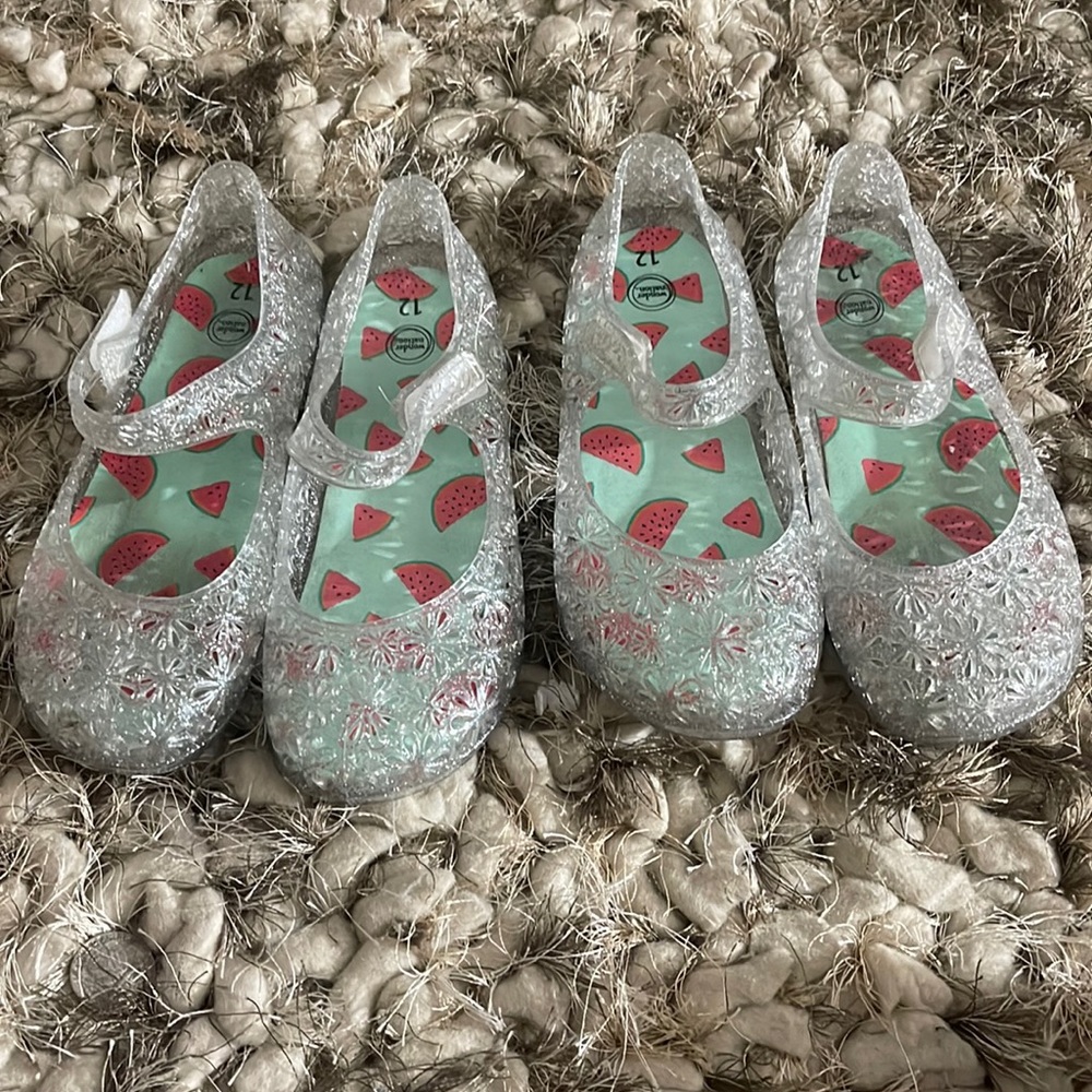 Two pair of silver jelly shoes